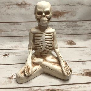 Skeleton Sitting Crossed Leg Grinning